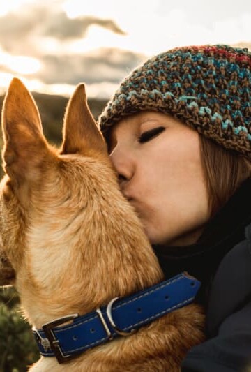 Woman hugging her dog