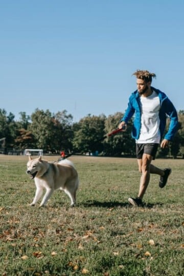 Man running with his dog