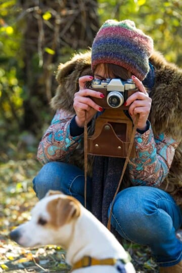 Woman taking a picture of a dog