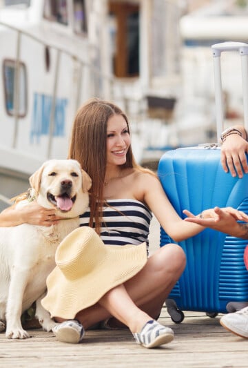 Man and woman on vacation with their dog